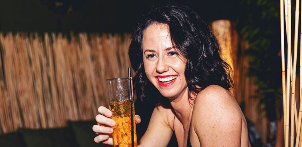 A beautiful woman enjoying her drink at Amuse Wine Bar