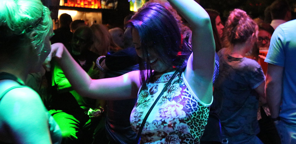 A woman dancing to the beat at Drake’s Bar