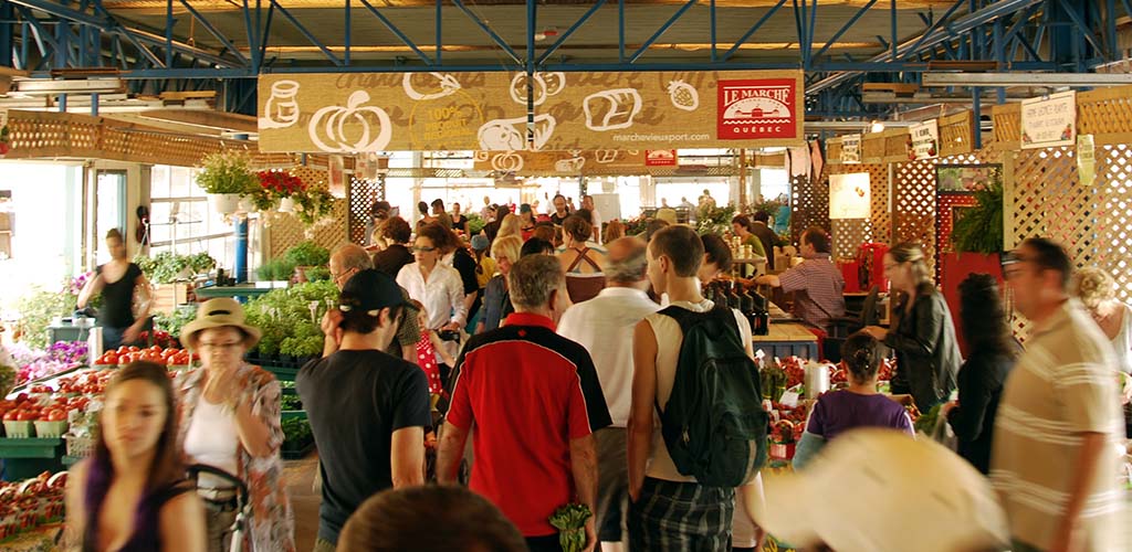 A crowd of people shopping at Marché du Vieux-Port 