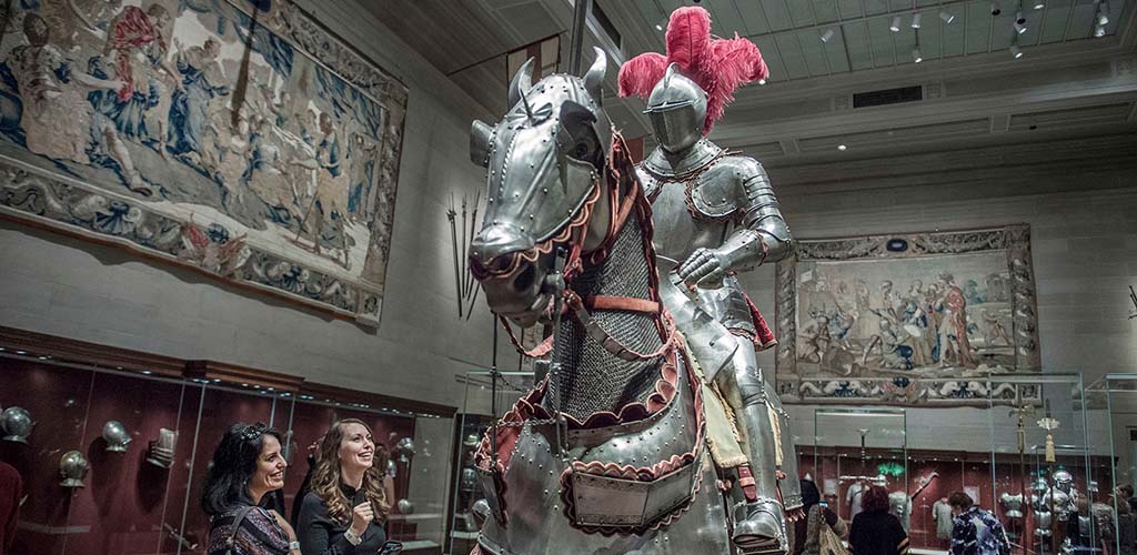 Women admiring the suit of armor at The Cleveland Museum of Art