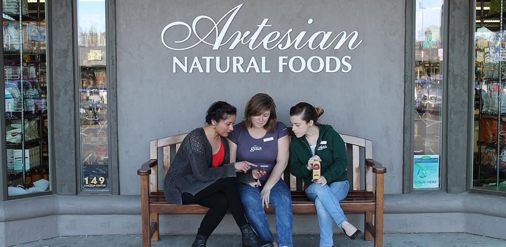 The front of Artesian Natural Foods with some regular patrons