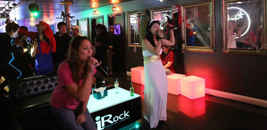 Ladies enjoying karaoke at iRock