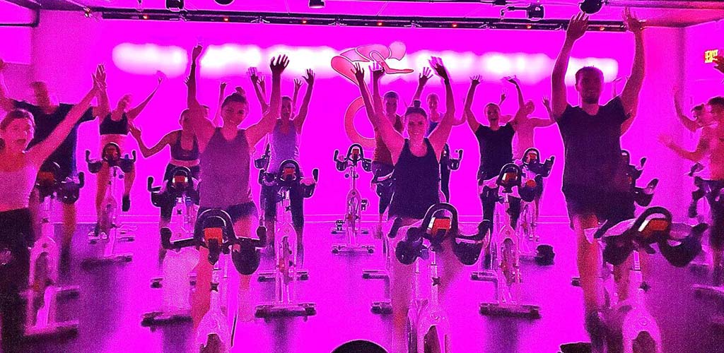 People at a spin class at Societe Indoor Cycling