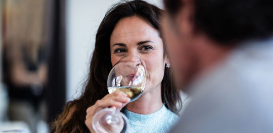 A beautiful woman drinking wine