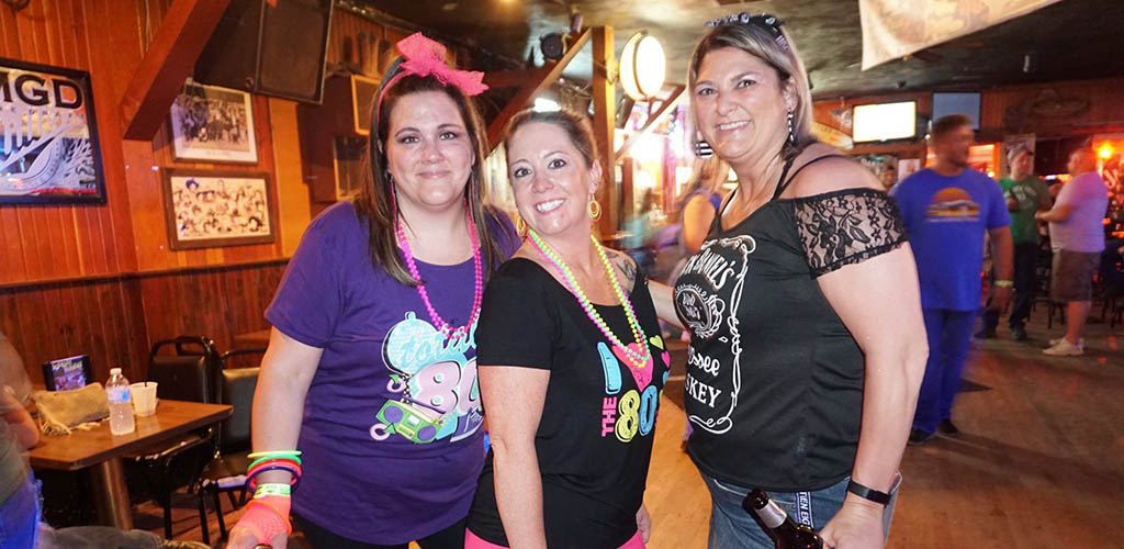 Ladies during an 80s theme party at Dusty Armadillo