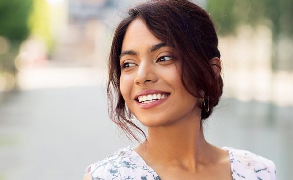 portrait of happy smiling indian woman outdoors