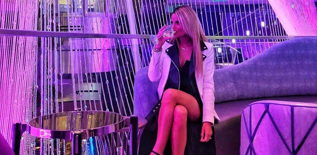 A gorgeous woman having a drink in the VIP area of The Cosmopolitan