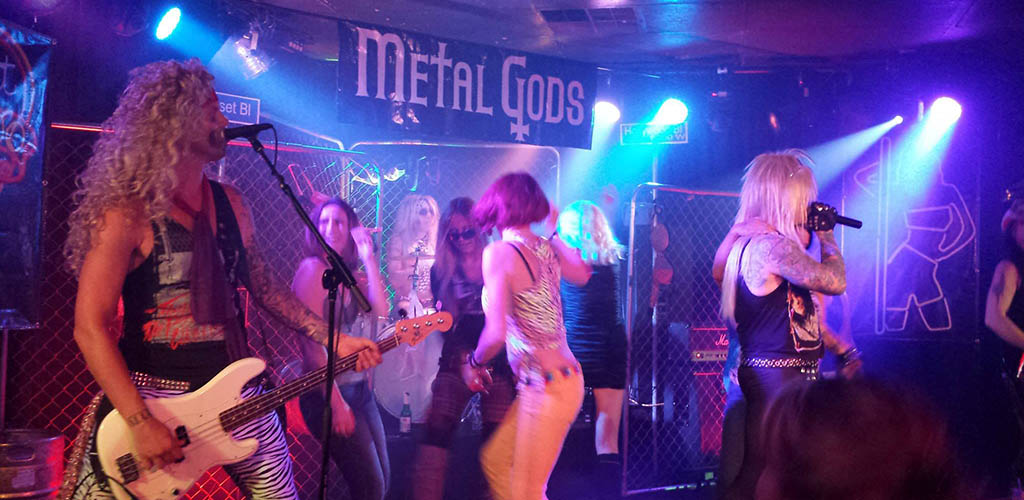 A live rock performance with the audience onstage at Liquid Joe's