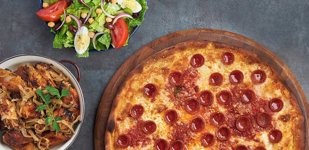 A pizza, casserole and salad from Anthony's Coal Fired Pizza