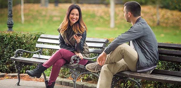 Man and woman flirting in park