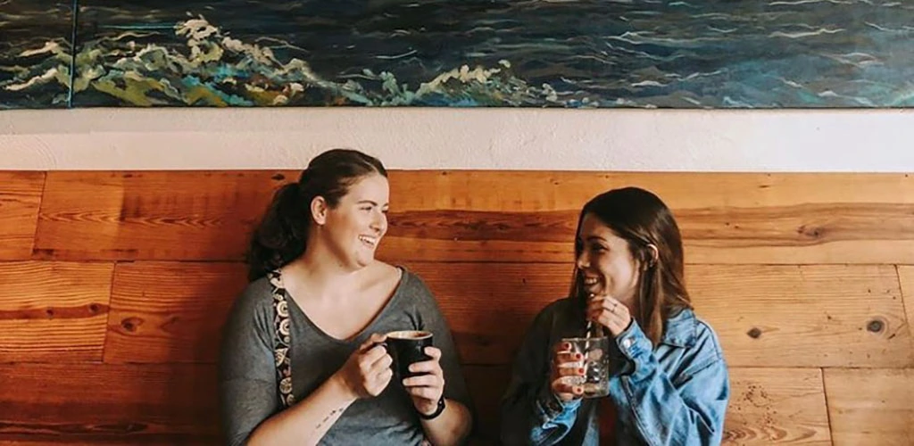 Friends enjoying some coffee from Three Ships Coffee