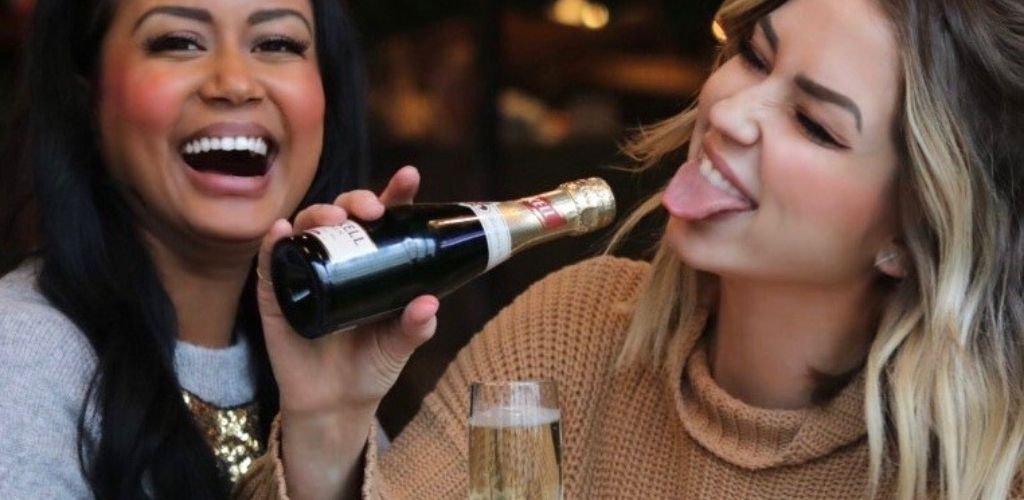 Two Vancouver singles drinking champagne at Craft Beer Market