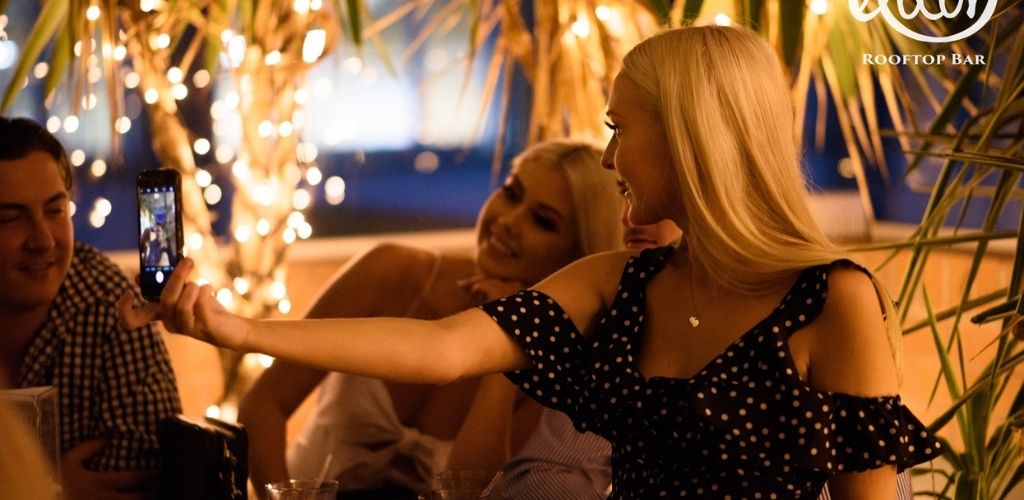 Cute Brisbane couples taking a selfie at Elixir Rooftop Bar