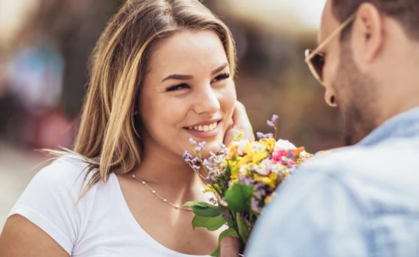 man flirting after learning how to pursue a woman