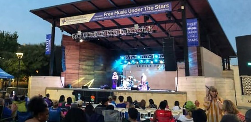 An outdoor musical performance at Levitt Pavilion