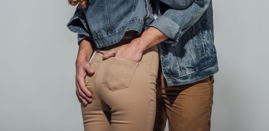 Man grabbing a girl's butt