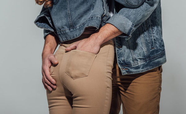 Man grabbing a girl's butt