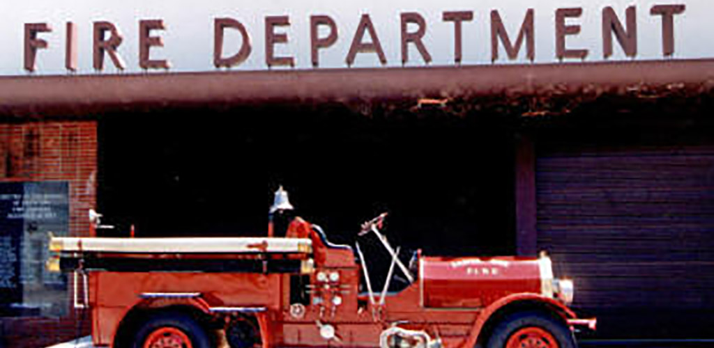A vintage photo of a firetruck from the Fire Museum