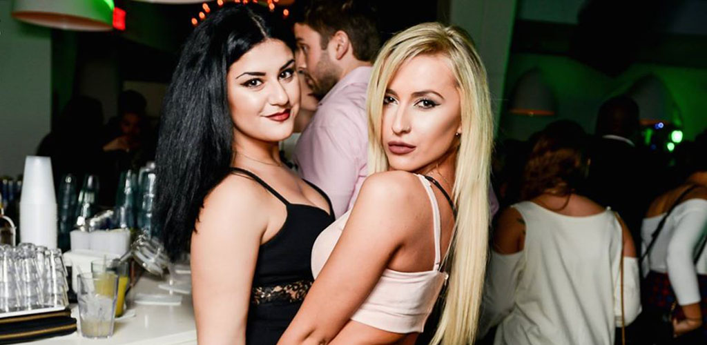 Two single women at a club