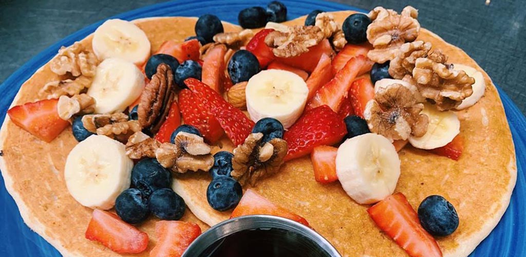 Pancakes topped with fruit from Bentley's House of Coffee and Tea