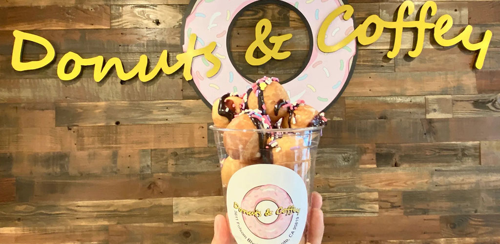 A cup of mini donuts from Donuts and Coffey