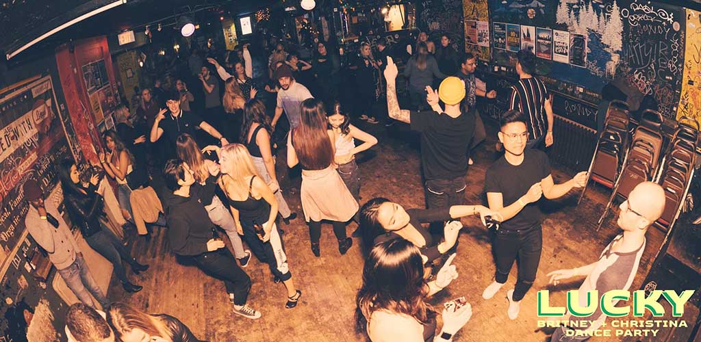 the fun dance floor full of young singles at the Sneaky Dees