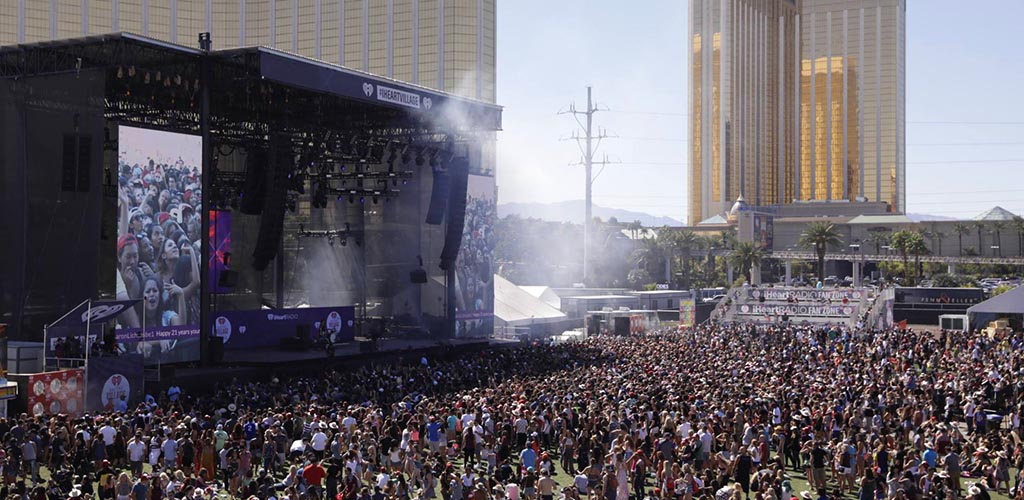 The audience watching a live performance at iHeart Festival