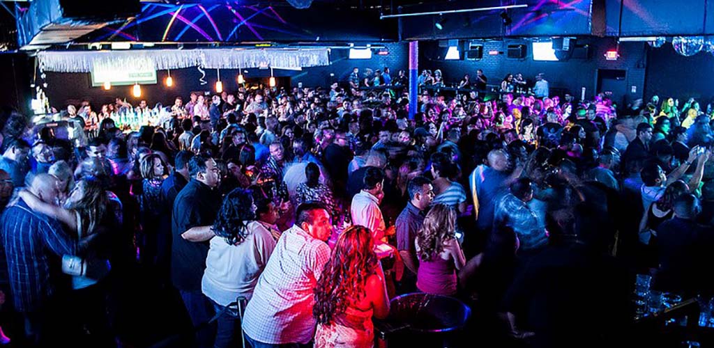 The huge dance floor of The Industry full of girls looking for hookups in San Antonio