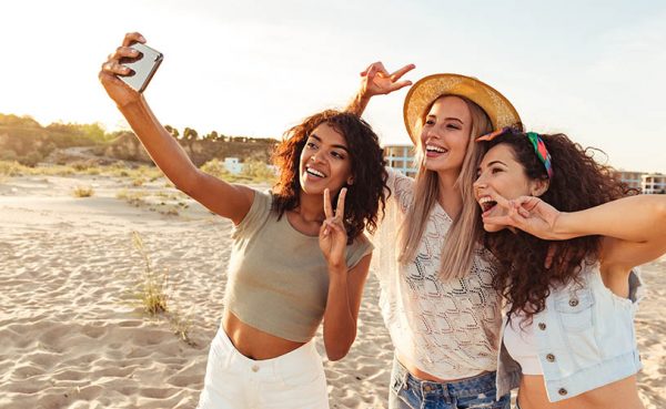 Hot Gold Coast girls taking selfies at the beach