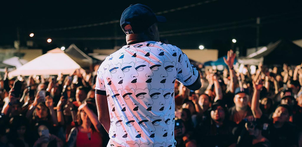 A crowd of singles getting amped up by a live performance at at The Happiness of Pursuit Festival while trying to find a hook up