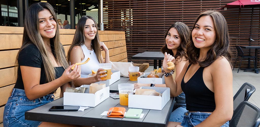 Single students having lunch at The Barn