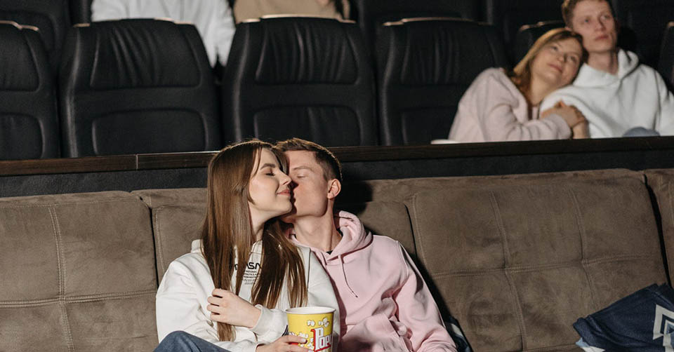 A couple making out at the movies