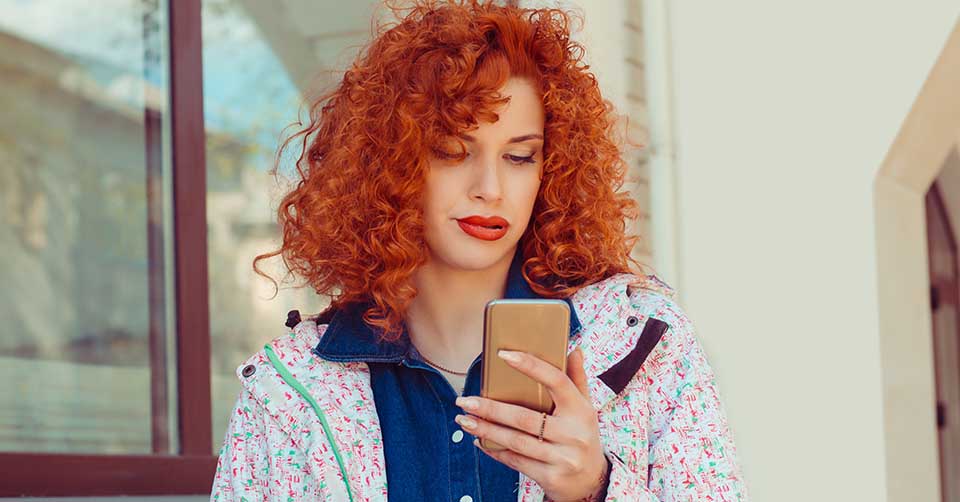 Woman bored while texting her online match