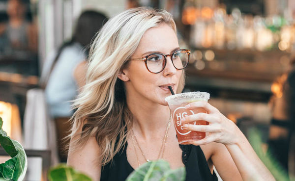 Blonde woman with iced tea looking for hookups in North Carolina