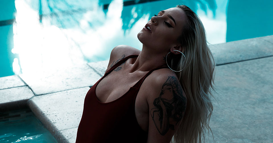A seductive woman at a pool