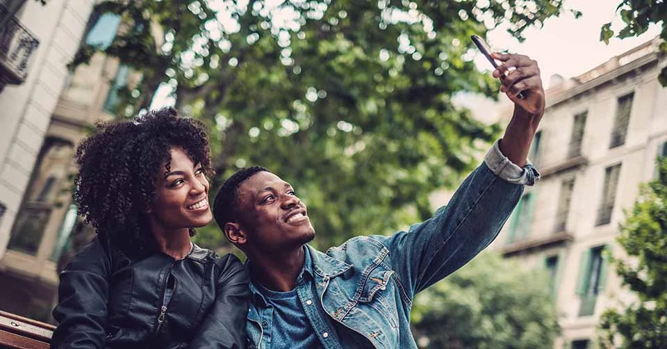 A couple taking a selfie while dating in Baltimore