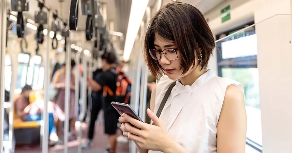 Using her favorite Vancouver dating app on the train