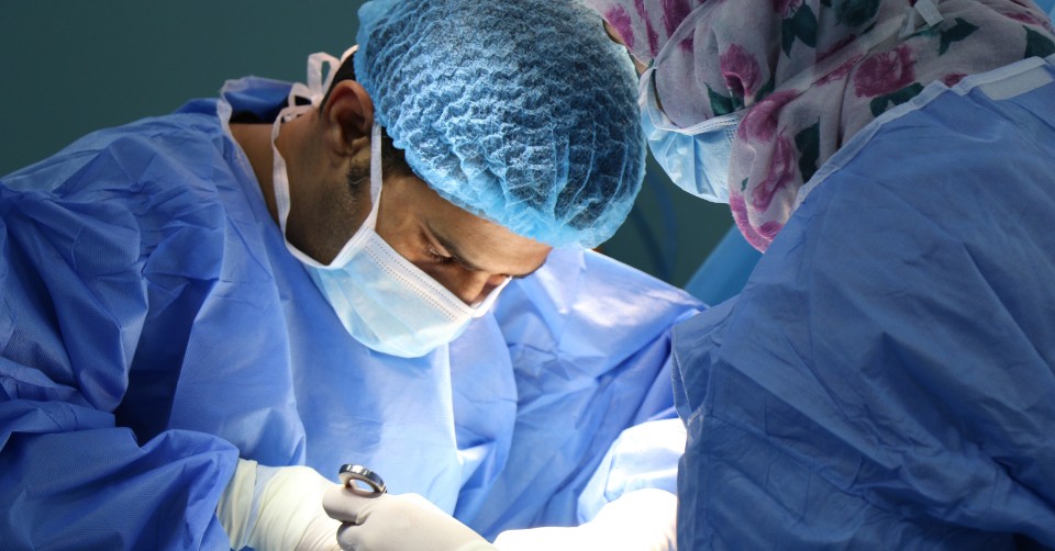 A doctor performing a surgery