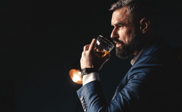 A classy man drinking whiskey