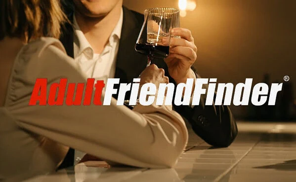 Man standing on a bar with a woman after they meet on AdultFriendFinder