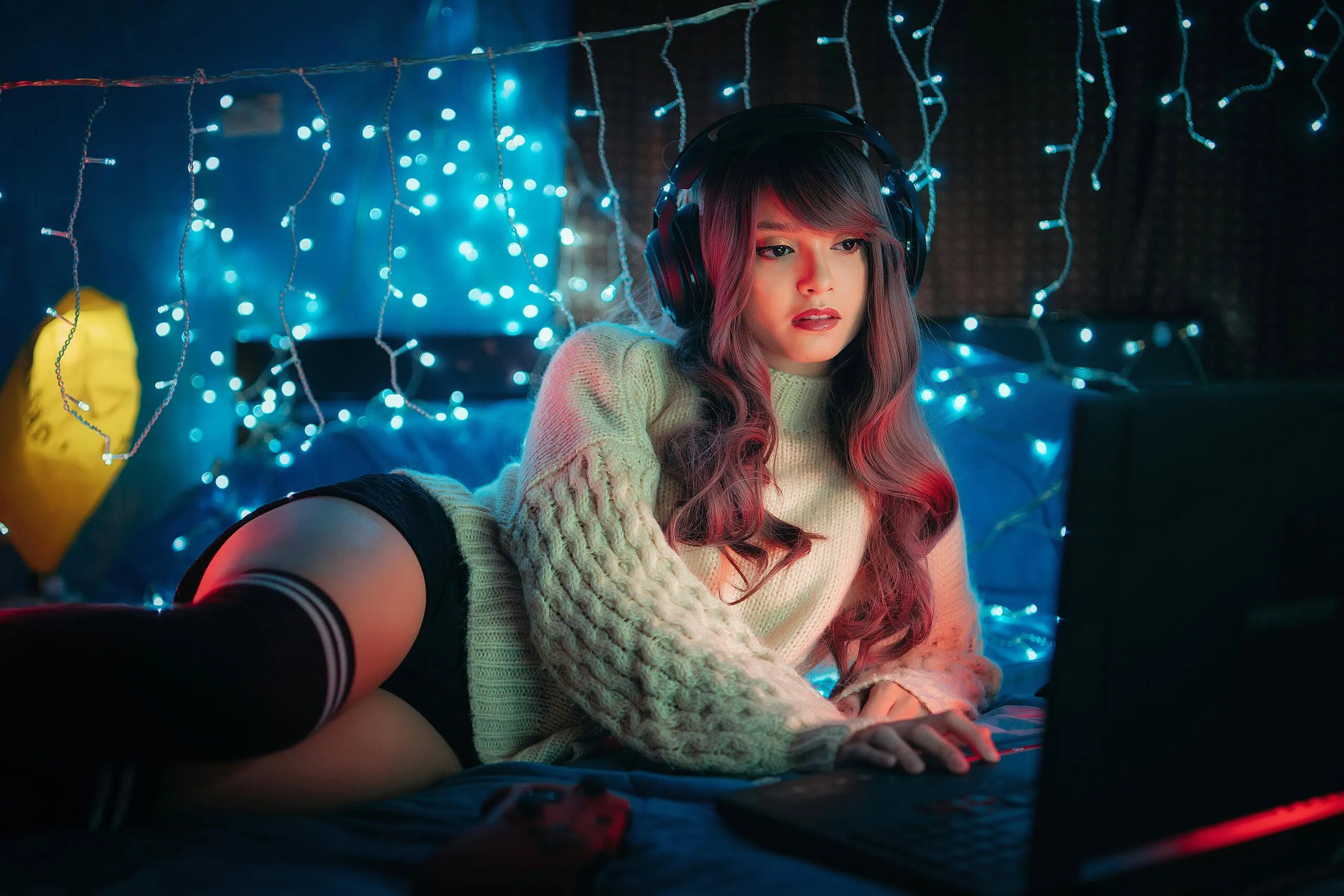 woman relaxing with laptop at home having an online cam video chat