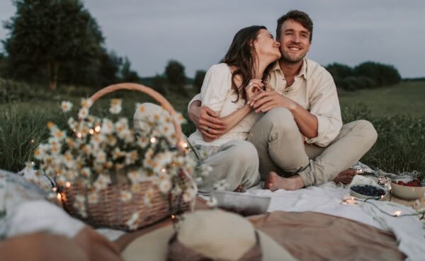 First date for a couple from a small town, having a picnic