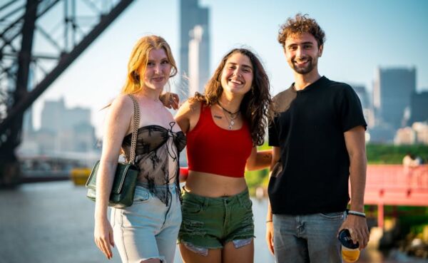 A split-screen image of a couple laughing, one side showing an urban skyline with neon lights and the other a rural starry field, highlighting diverse dating vibes.
