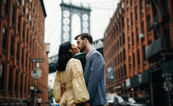 A couple enjoys a casual date on a NYC street