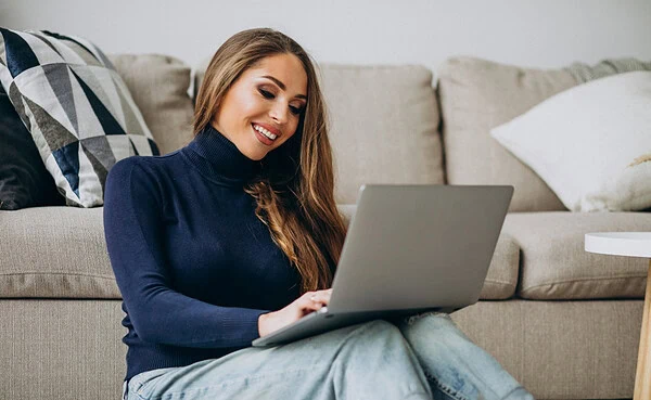 Woman enjoying random video chat on laptop, exploring LuckyCrush alternatives for real connections in 2025