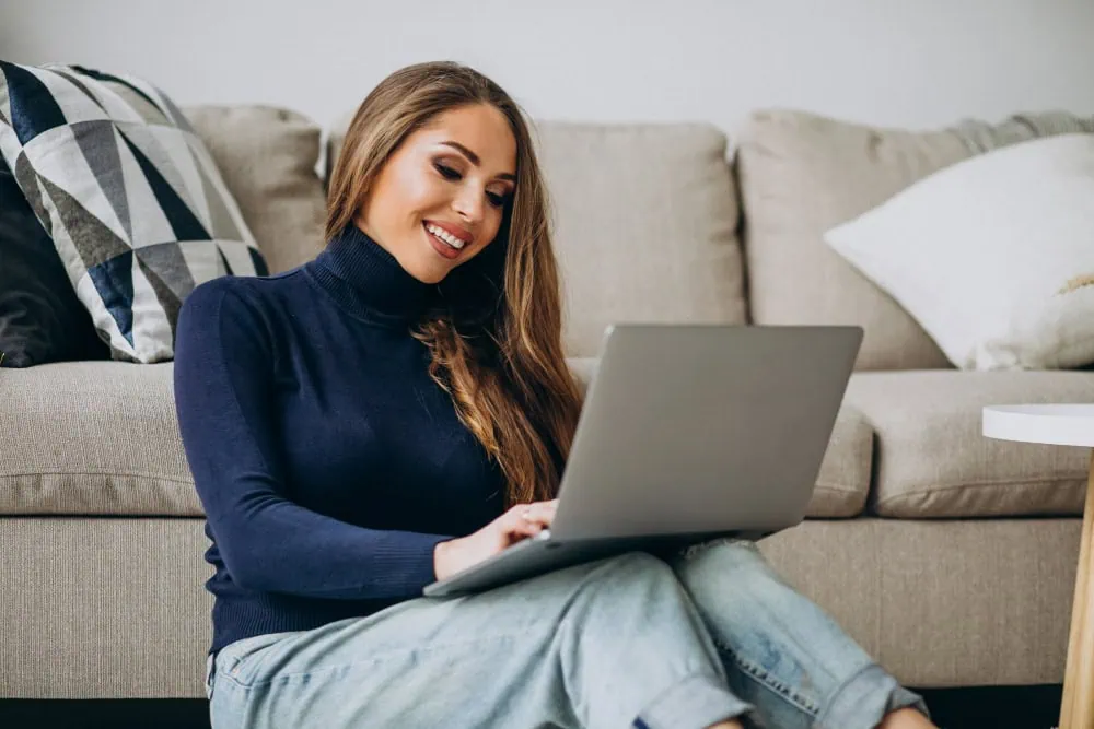 Woman enjoying random video chat on laptop, exploring LuckyCrush alternatives for real connections in 2025